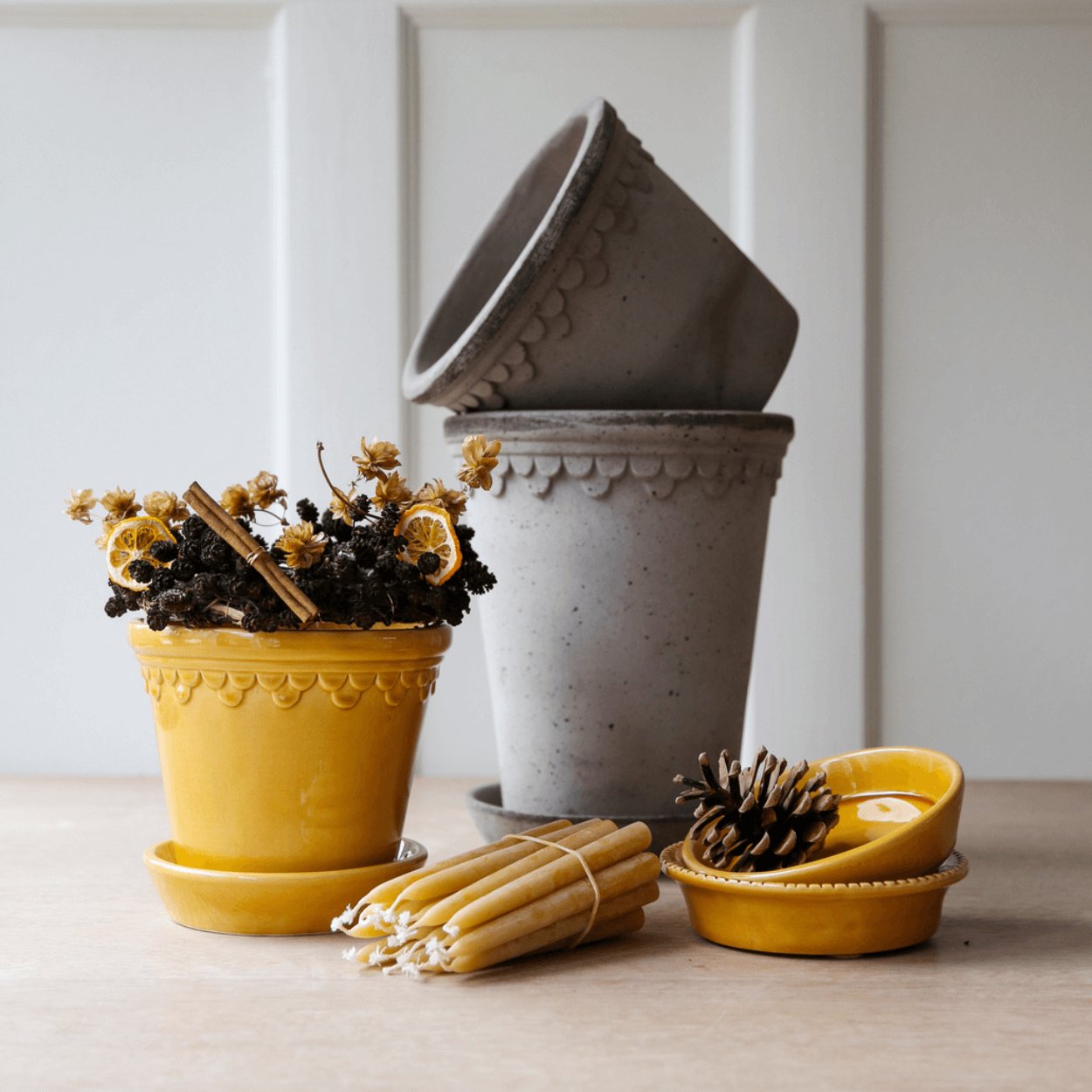yellow copenhagen plant pot with christmas flower decorations