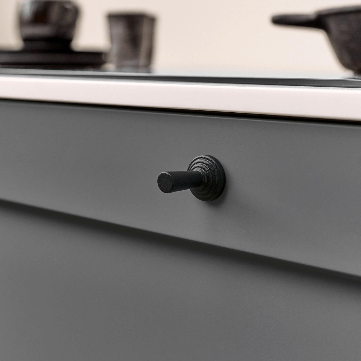 motion cast iron knob fixed to kitchen door